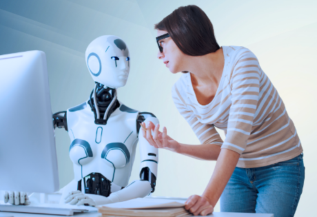 Woman learning AI technology with friendly robot assistant - representing accessible, hands-on AI education