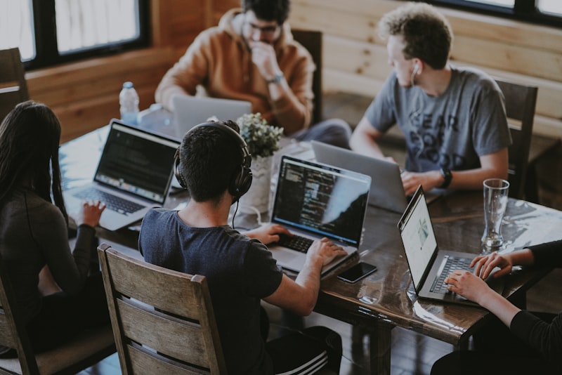 Diverse team working with AI technology